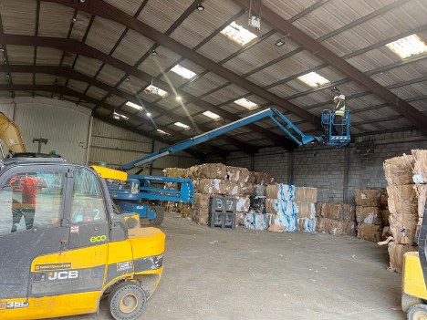 Warehouse Interior with Forklift and Cherry Picker